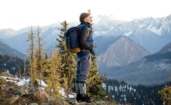 Tom hiking with the Guide's Pack.